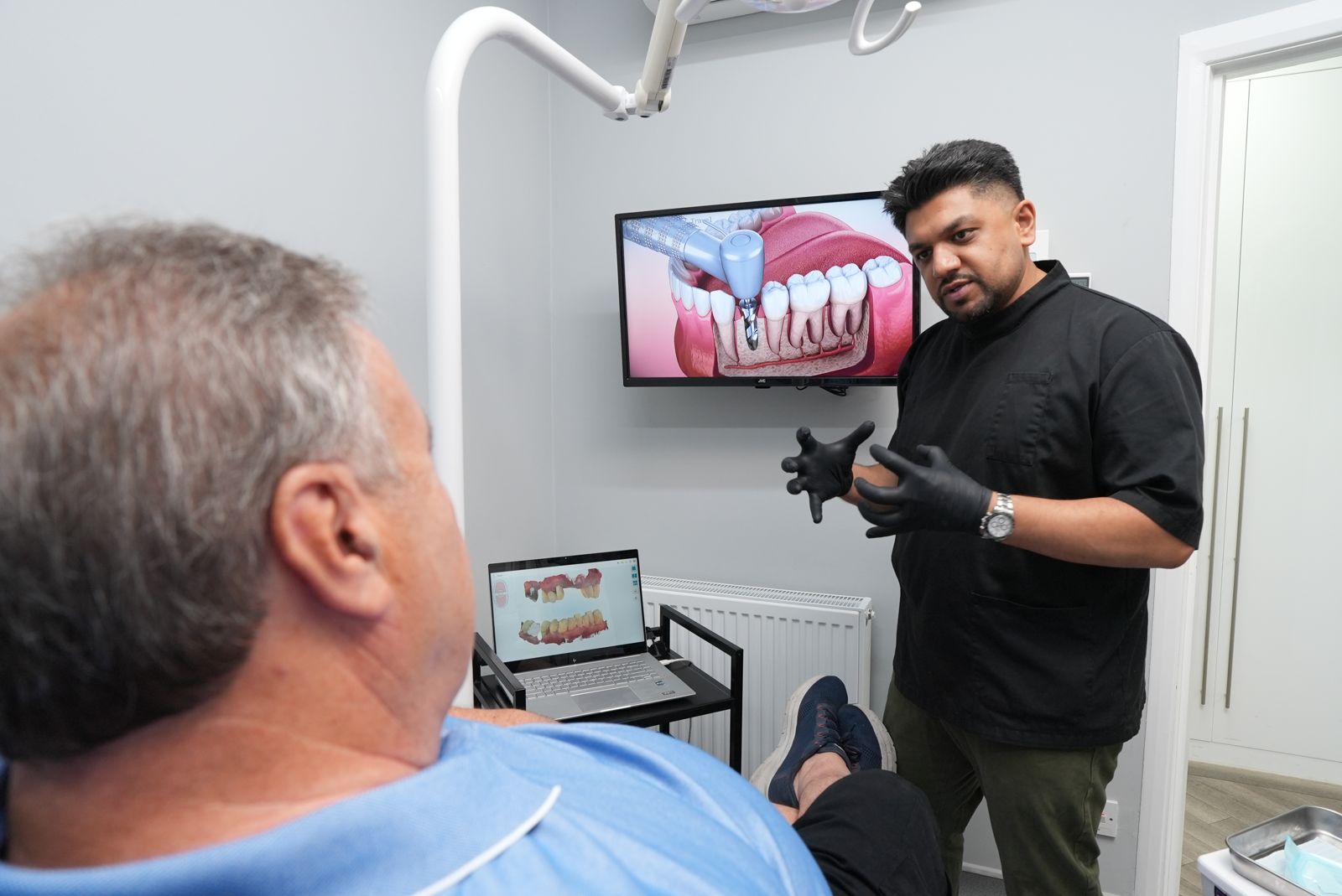 Dentist explaining a treatment plan on screen